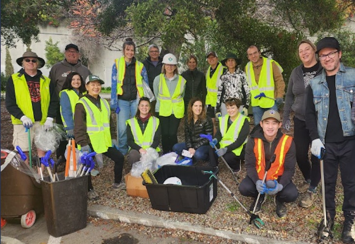 Group of volunteers with vest and tools