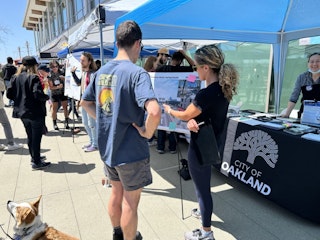Image of OakDOT staff at Ferry Fest talking about the Embarcadero West Rail Safety and Access Improvements.
