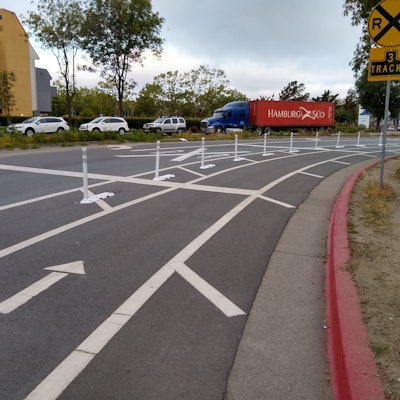 Bollards installed on Embarcadero to keep motorists from parking in the bike lane