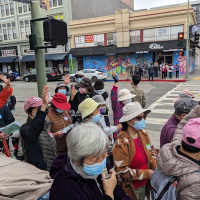 Group of residents walking around Chinatown as part of the June 24, 2023 site walk