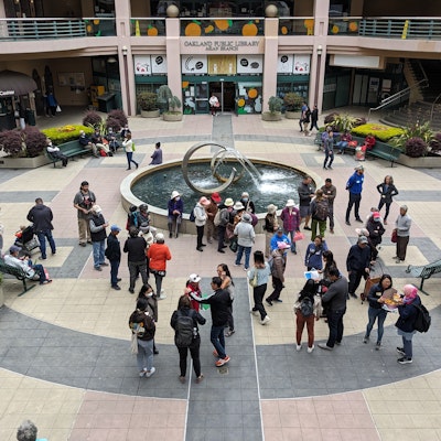 Group of residents gathered at Pacific Renaissance Fountain in Oakland Chinatown