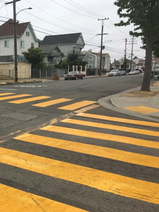 A high-visibility crosswalk installed by the Safe Streets Maintenance team