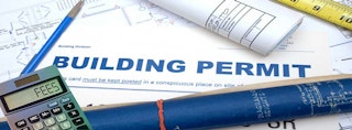 Building permit graphic showing sample blueprints and fee calculator
