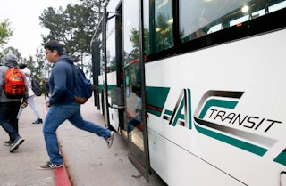 Passengers getting off AC Transit bus
